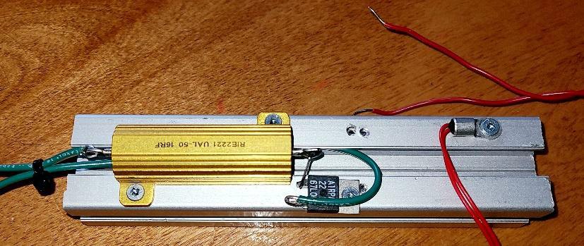 The heat block: a power resistor acting as the heater with a thermistor mounted next to it on an aluminum rail